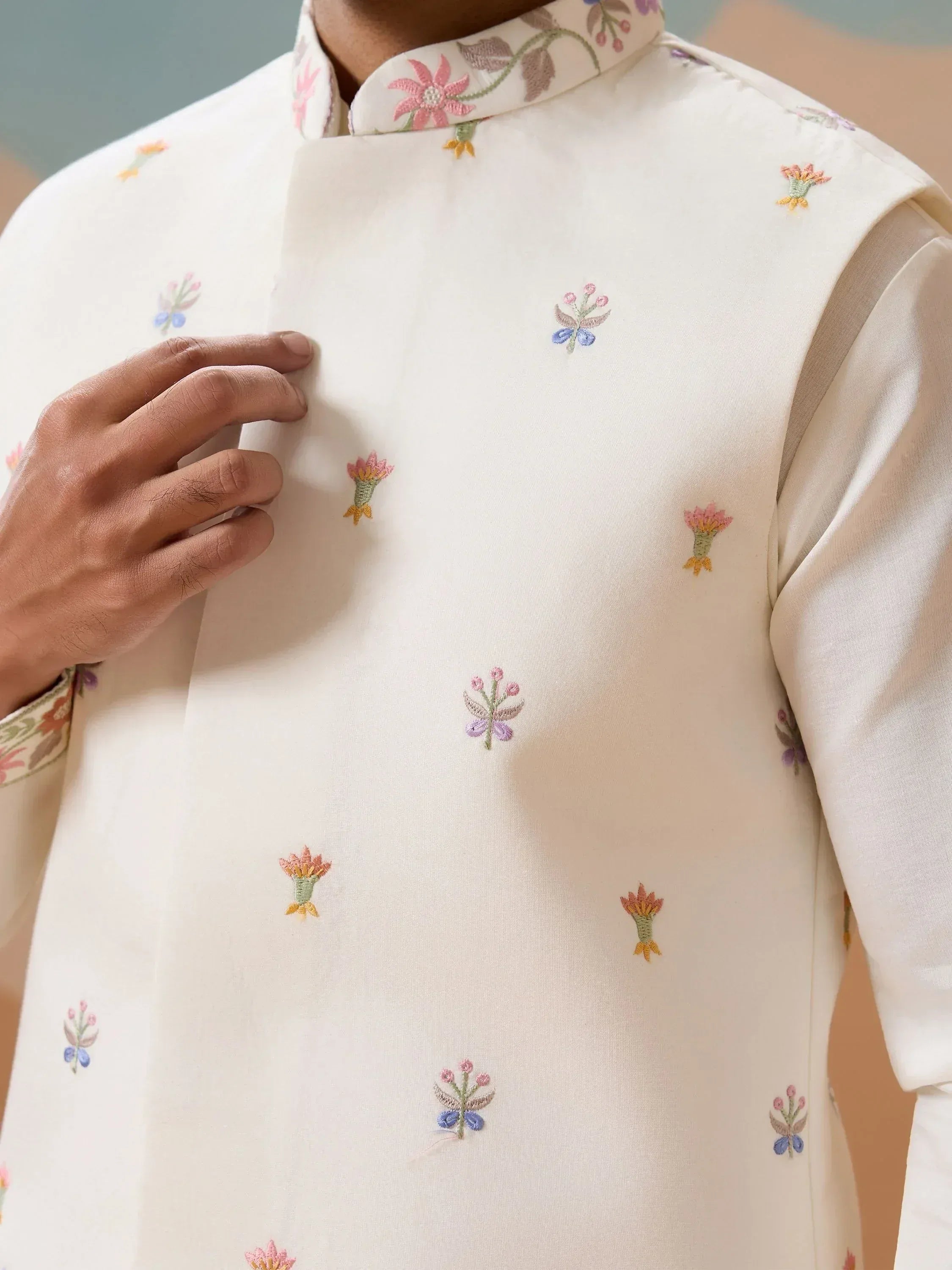Ivory kurta with delicate floral embroidery, perfect for Indian ethnic wear occasions.
