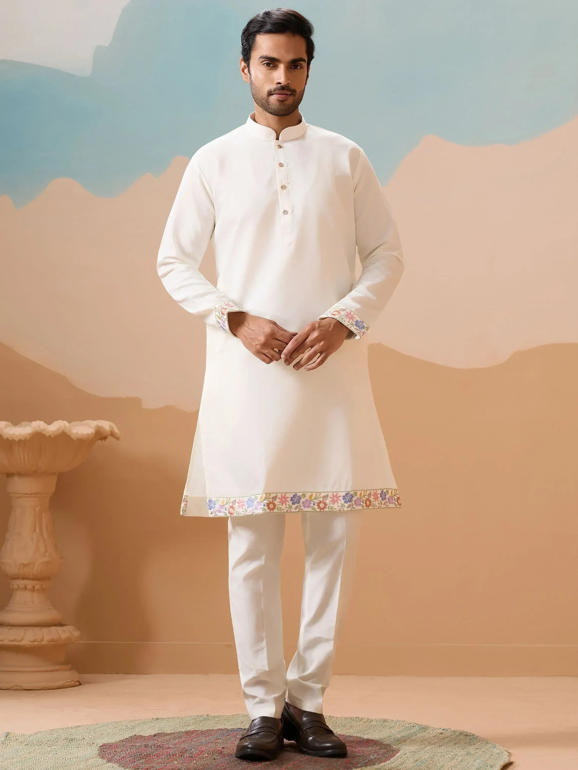 White embroidered kurta pajama set with floral detailing, perfect for Indian ethnic wear occasions