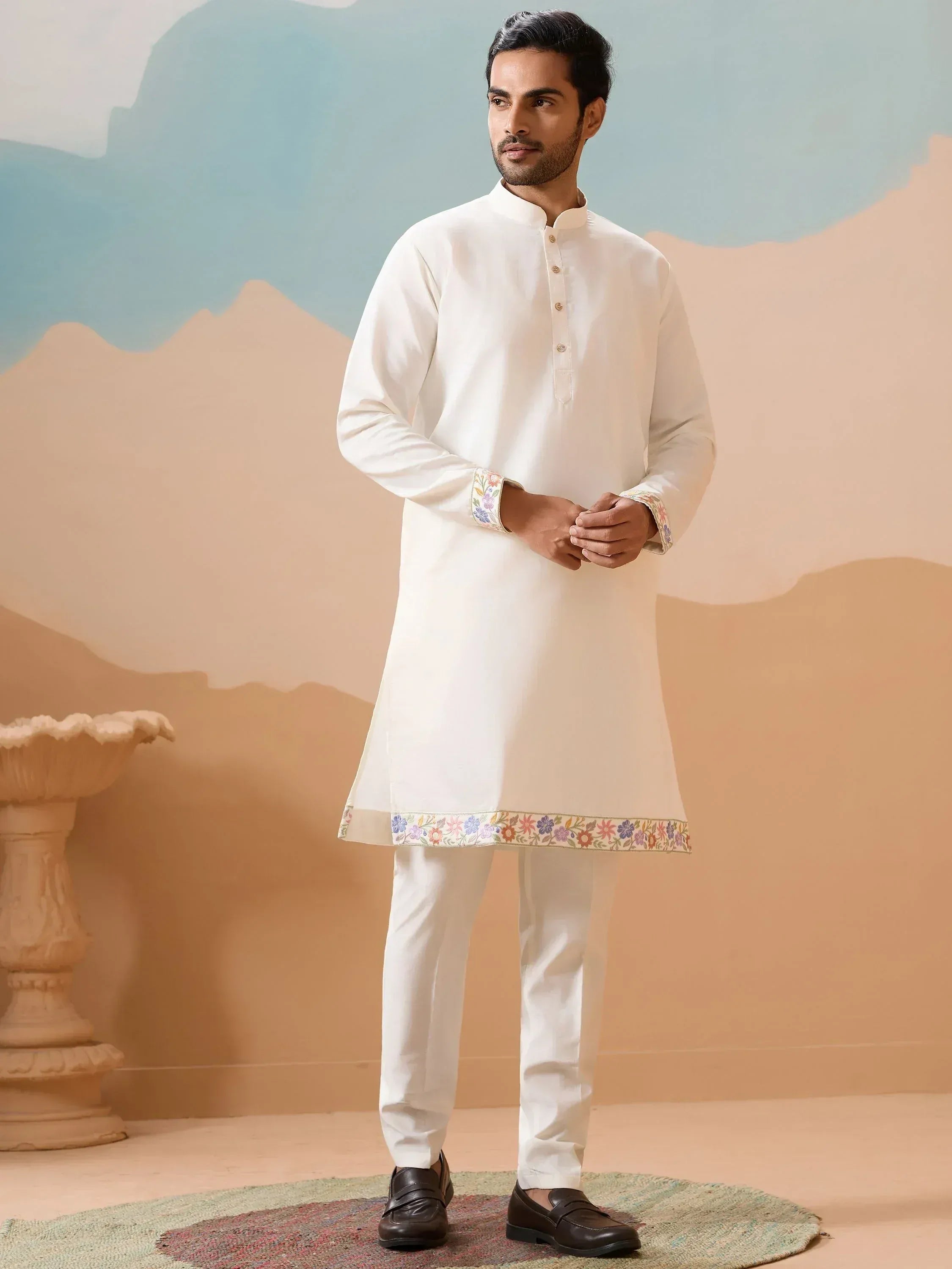 White embroidered kurta pajama set with floral detailing, perfect for Indian ethnic wear occasions