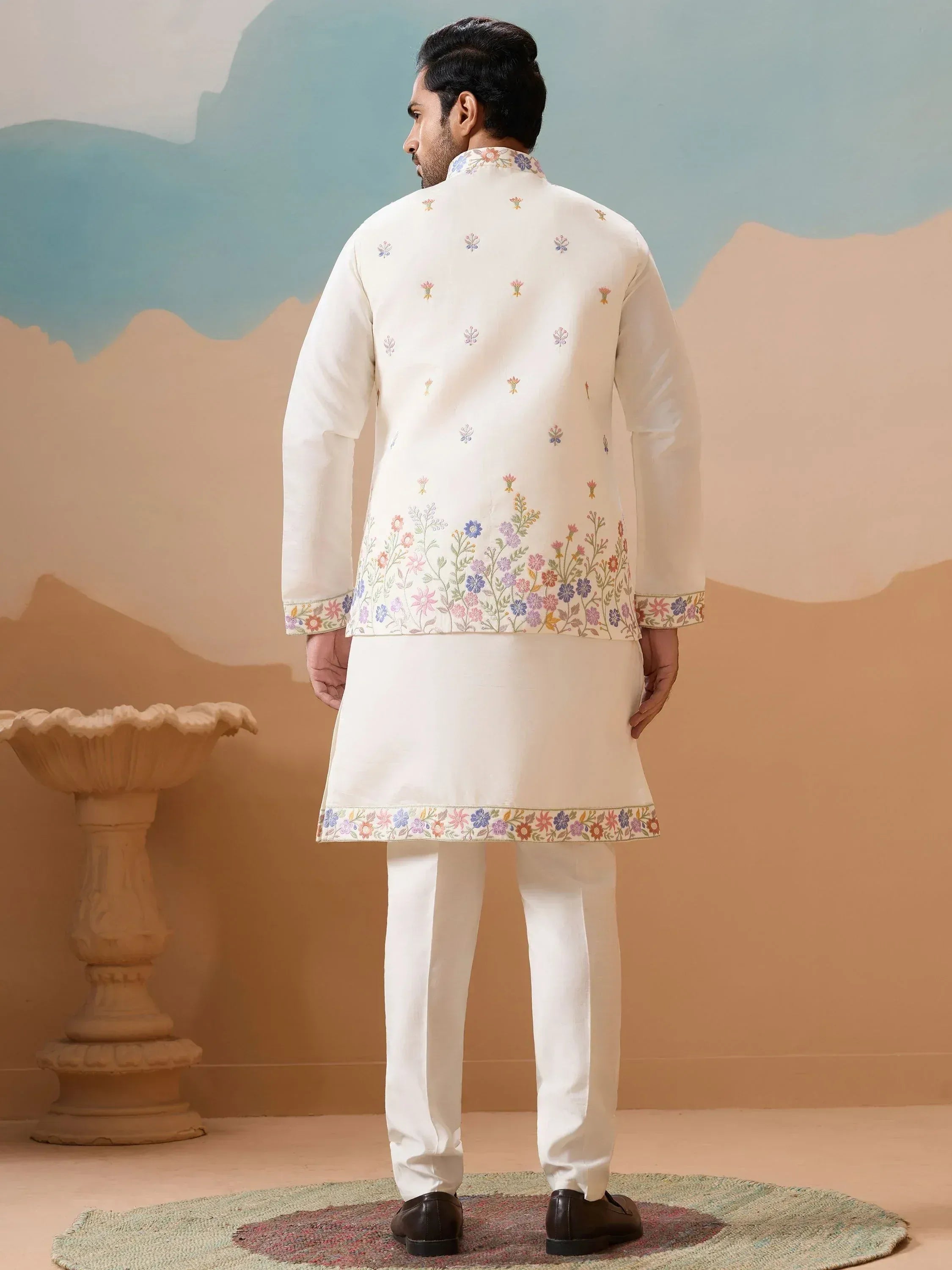 Men's white kurta set with floral embroidery, perfect for Indian ethnic occasions