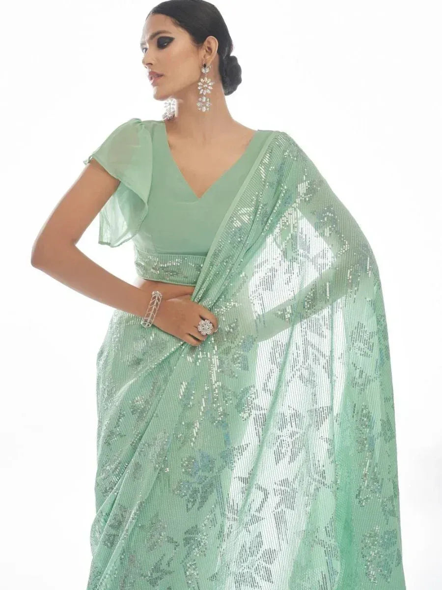 Mint green sequin saree with ruffled blouse, ethnic Indian wear for weddings and parties
