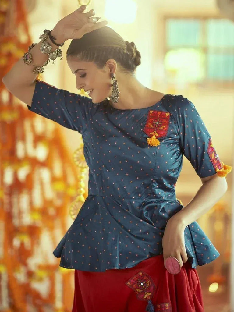 Blue polka dot peplum top with red embroidered details, paired with red skirt, ethnic wear