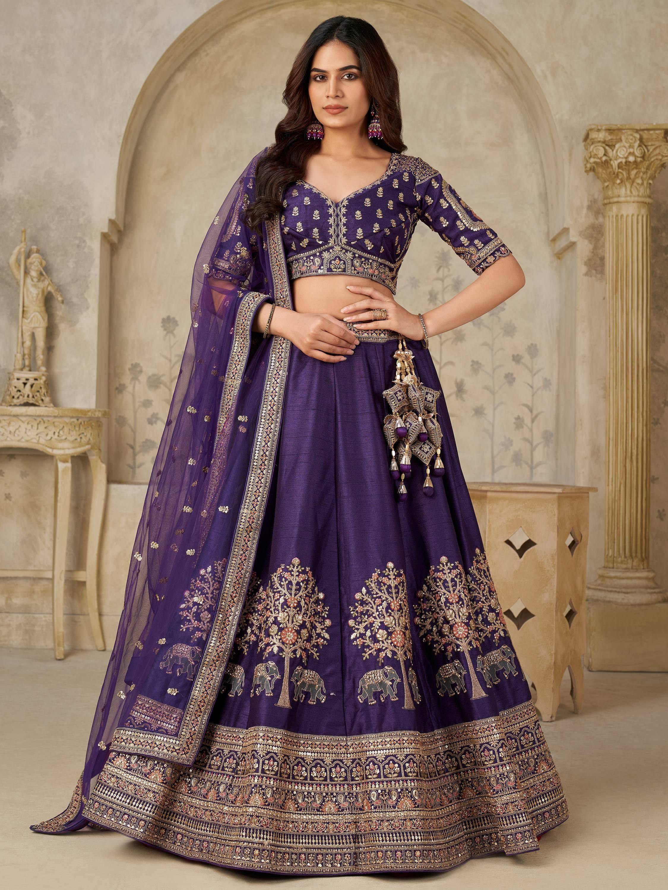 Purple embroidered lehenga choli with elephant and tree motifs, perfect for Indian ethnic wear