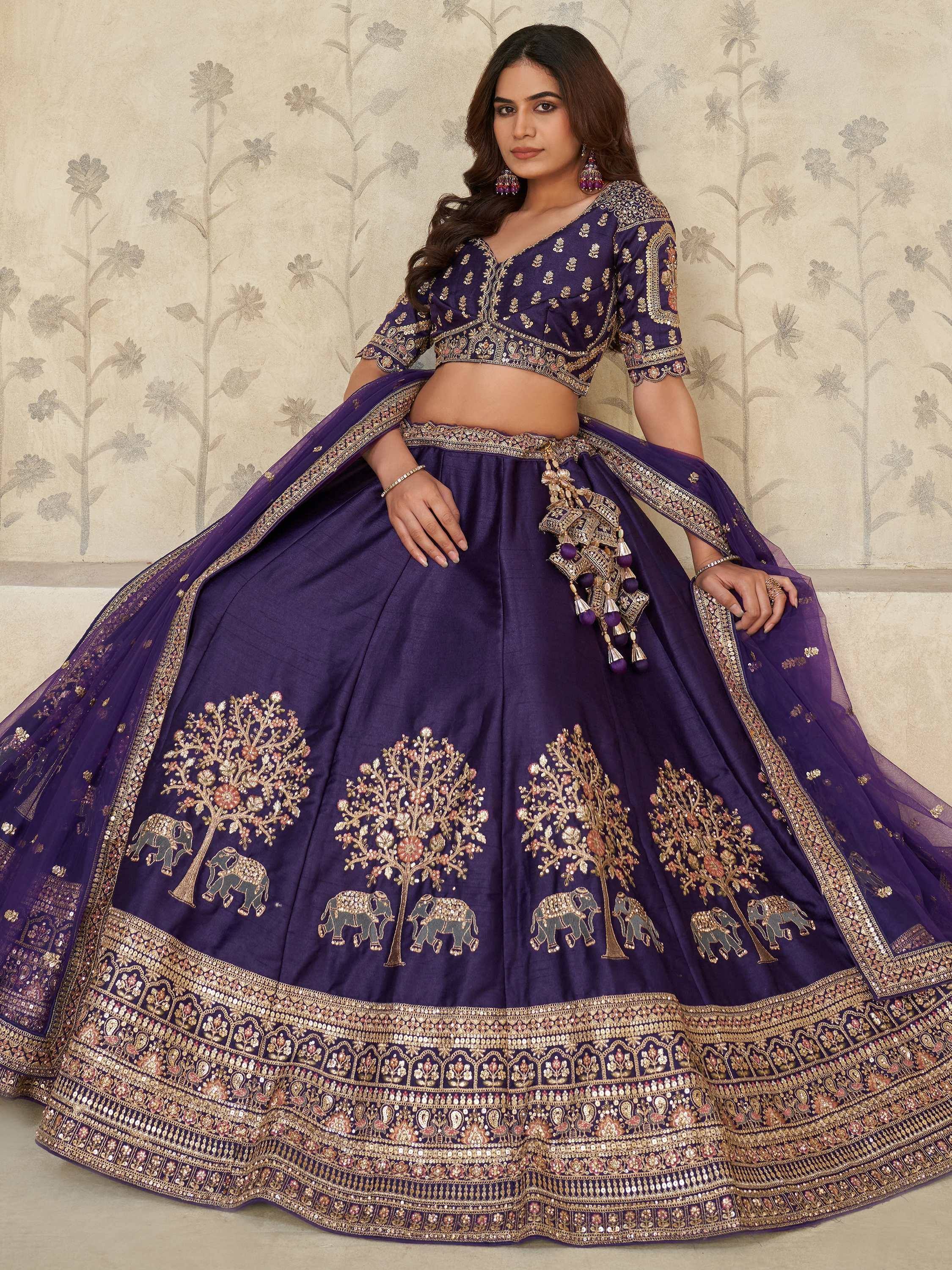 Purple designer lehenga choli with elephant and tree embroidery, perfect for Indian weddings and festivals