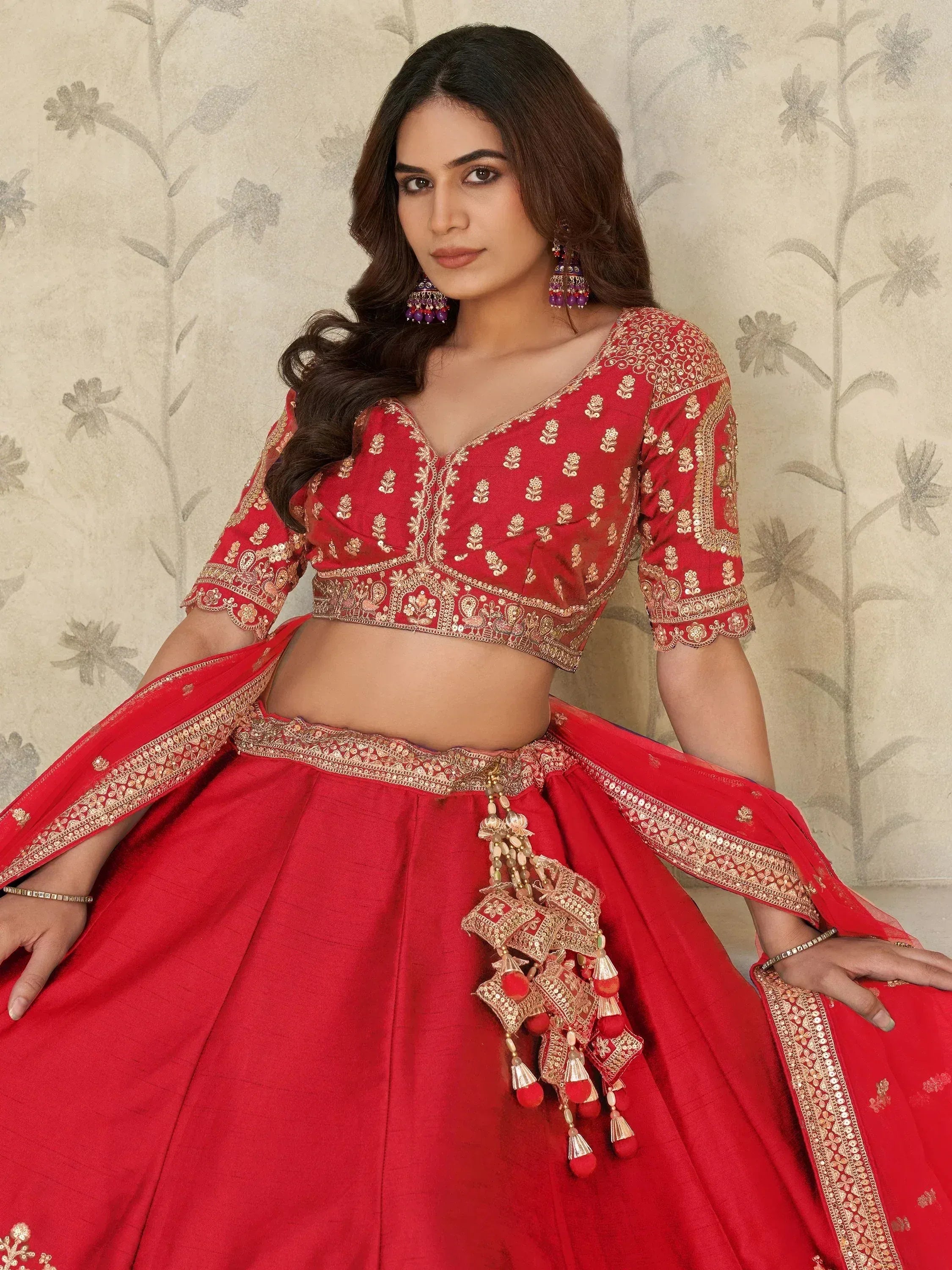 Red embroidered lehenga choli with gold detailing, perfect for Indian ethnic wear and festive occasions.