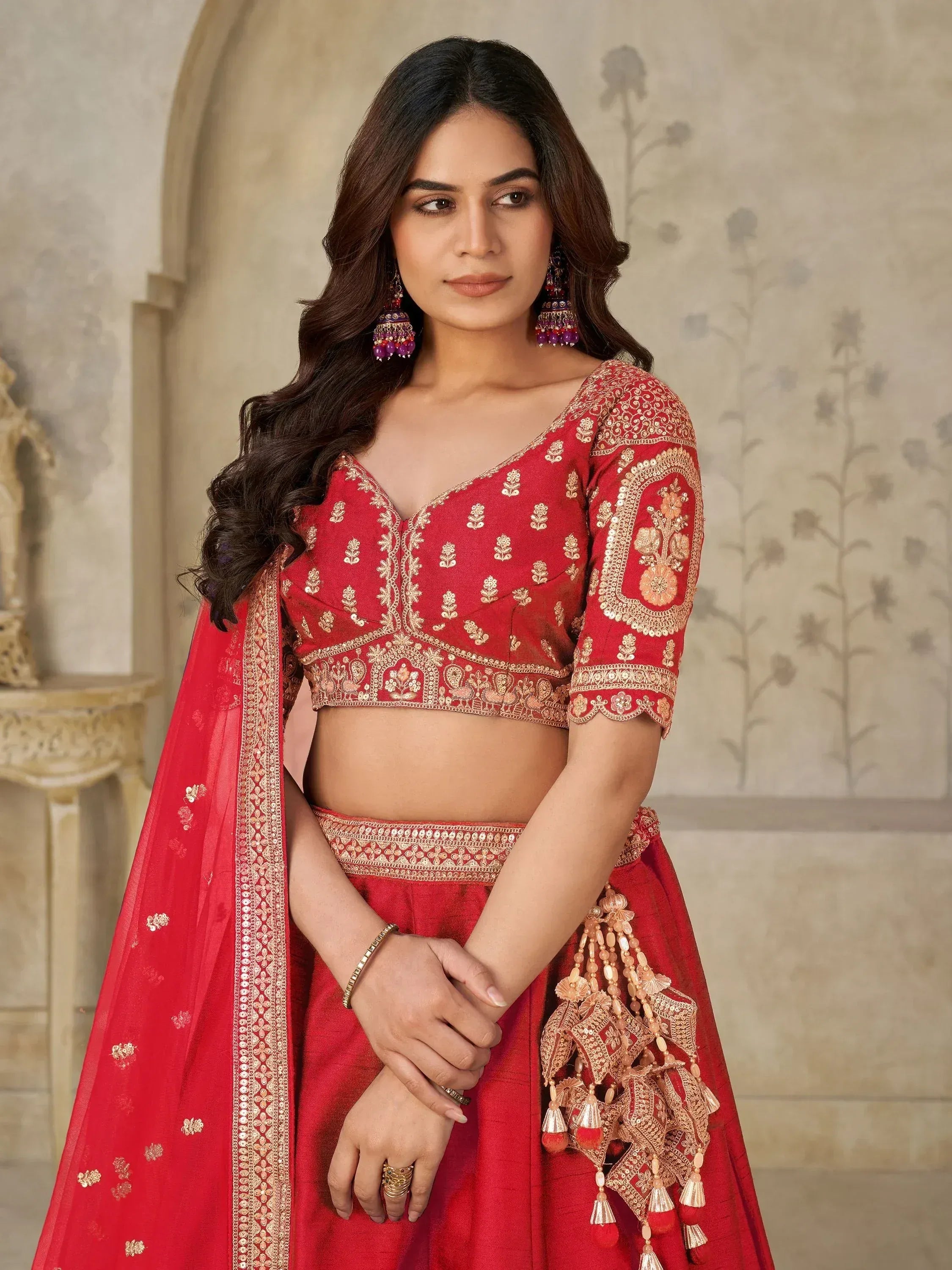 Red embroidered lehenga choli with gold detailing, perfect for Indian ethnic wear and festive occasions.