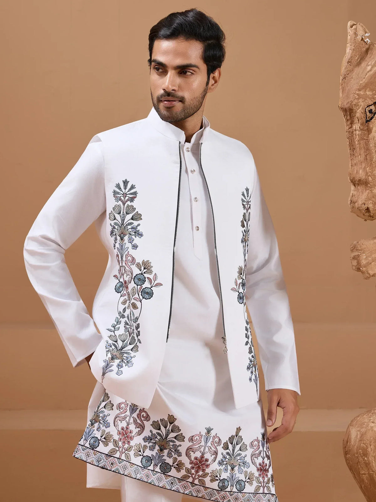 White embroidered kurta set with floral patterns, perfect for Indian ethnic wear occasions