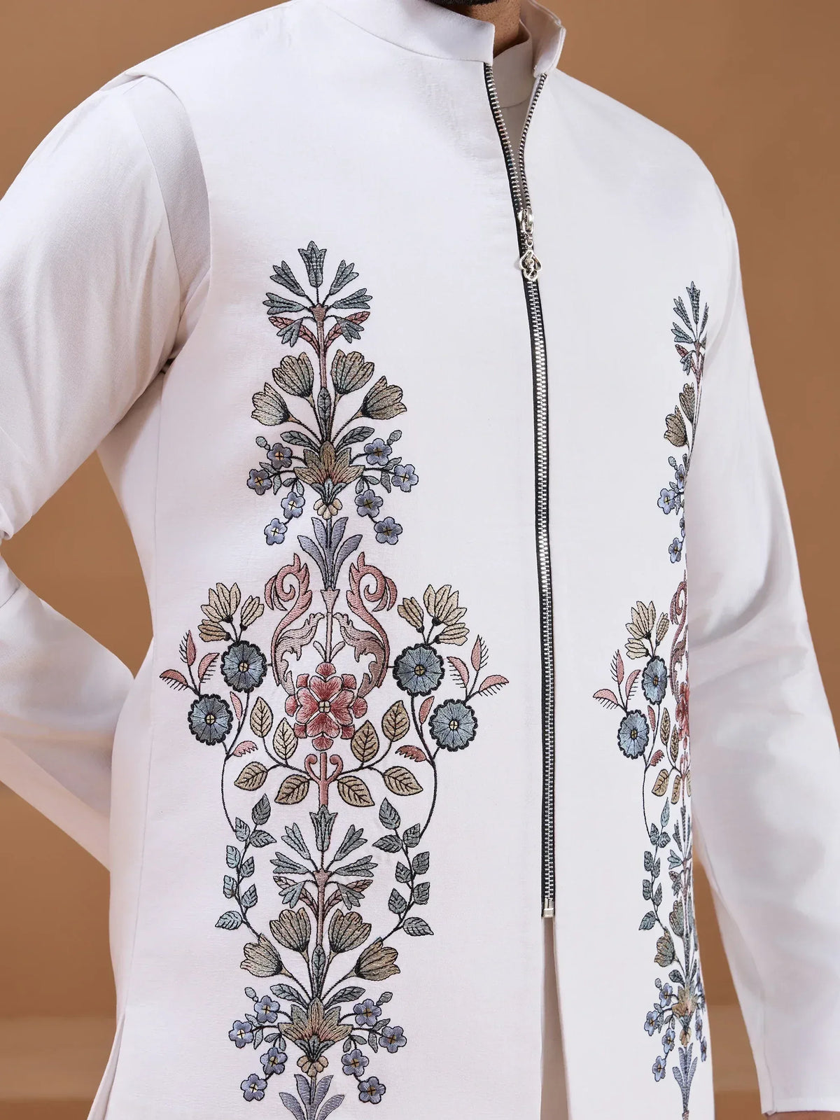 White kurta with intricate floral embroidery and front zipper, ideal for ethnic wear occasions