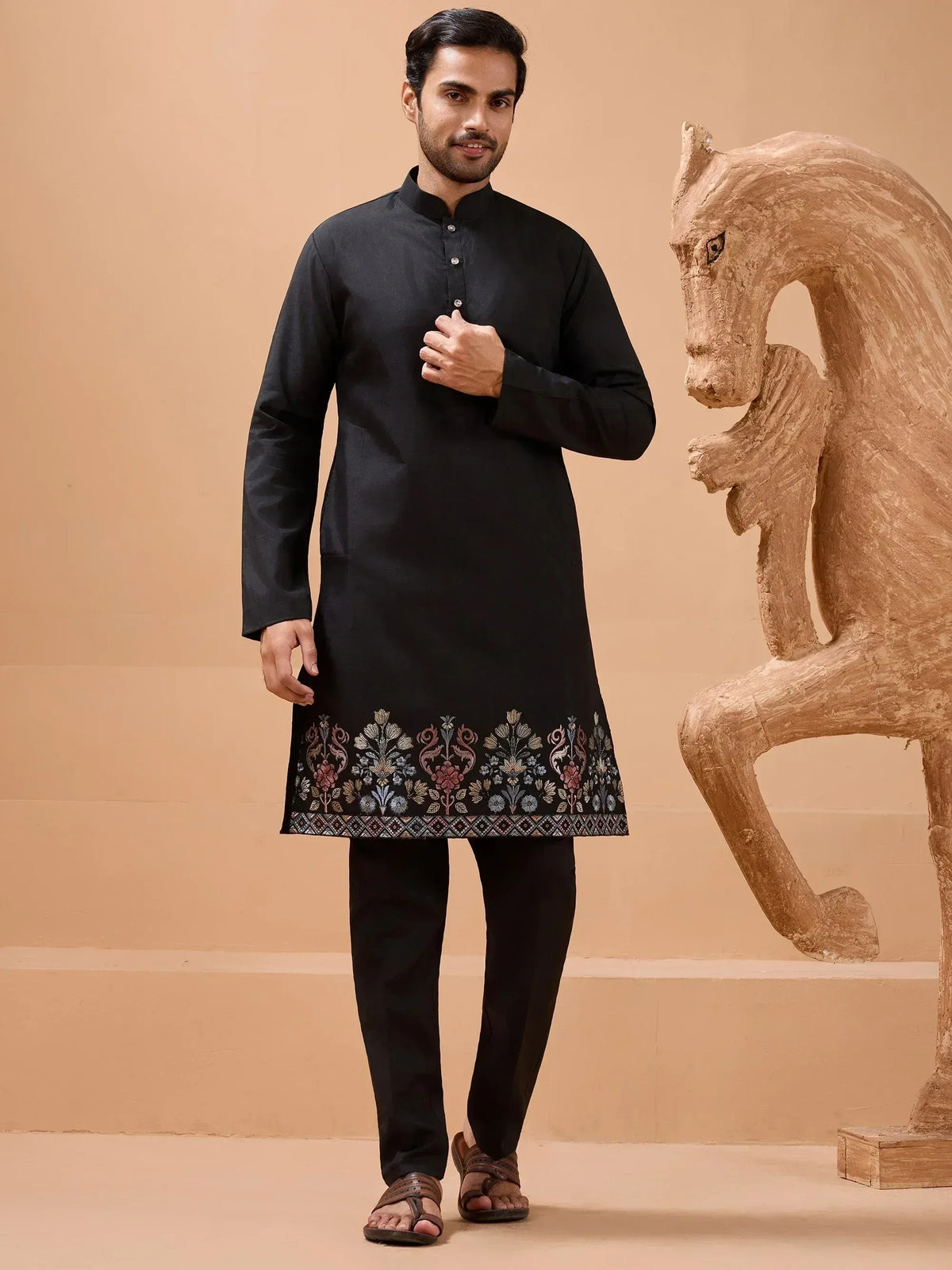 Black embroidered kurta set with floral border, men's ethnic wear for festive occasions