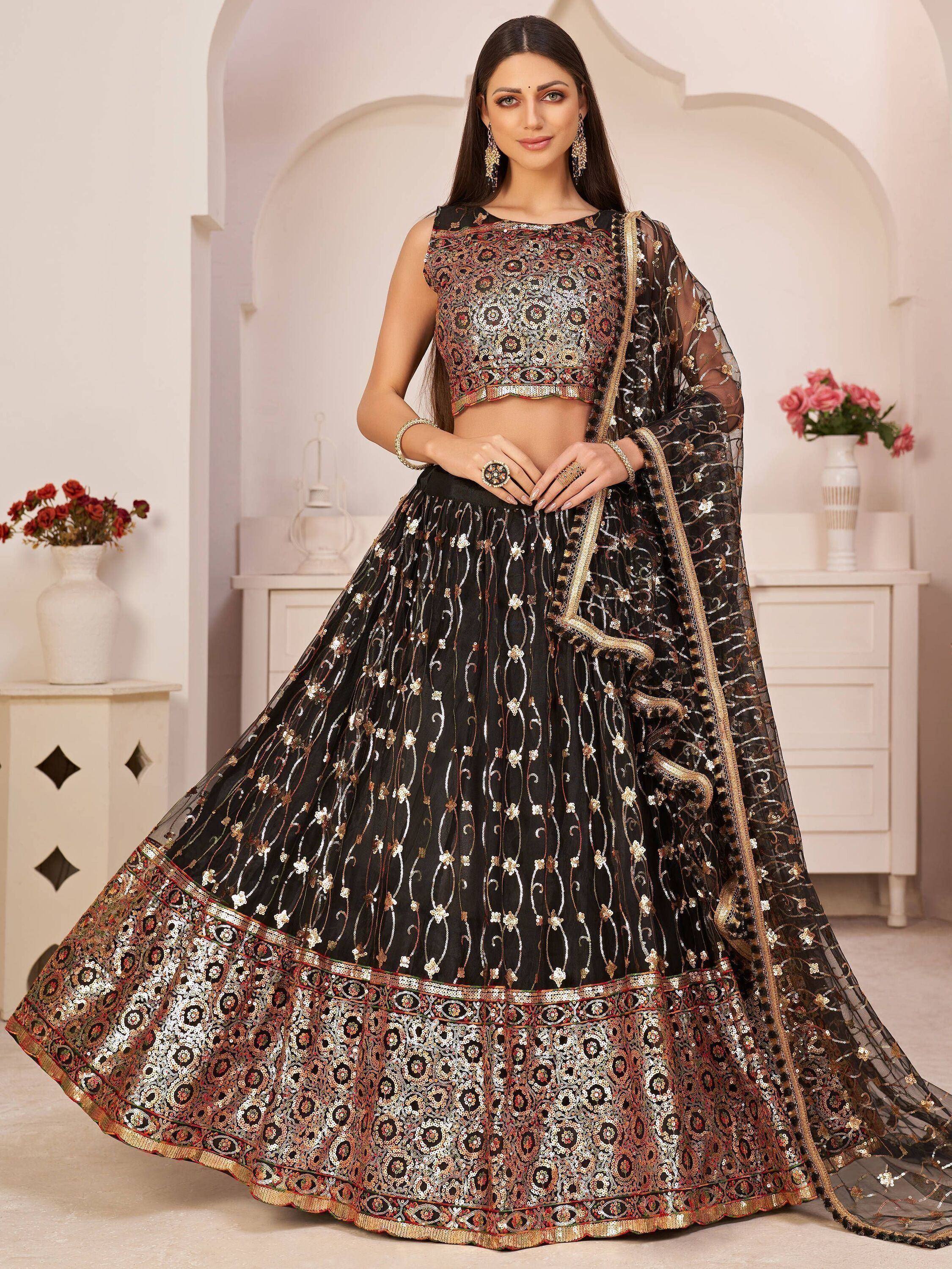 Black embroidered lehenga choli with gold detailing, perfect for Indian weddings and festive occasions.