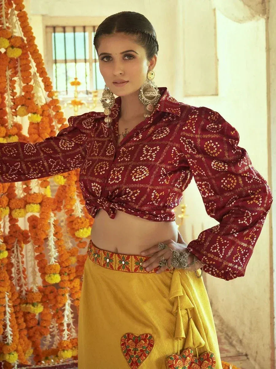 Maroon printed crop top with yellow skirt, ethnic Indian wear, floral garlands background