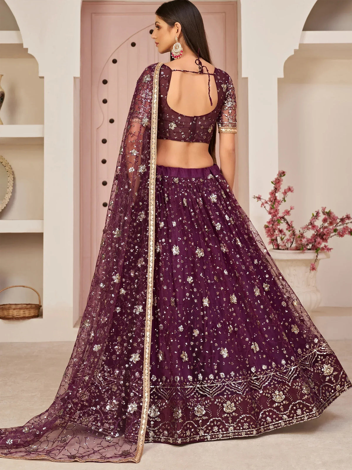 Elegant purple lehenga choli with gold embroidery and sheer dupatta for Indian ethnic wear