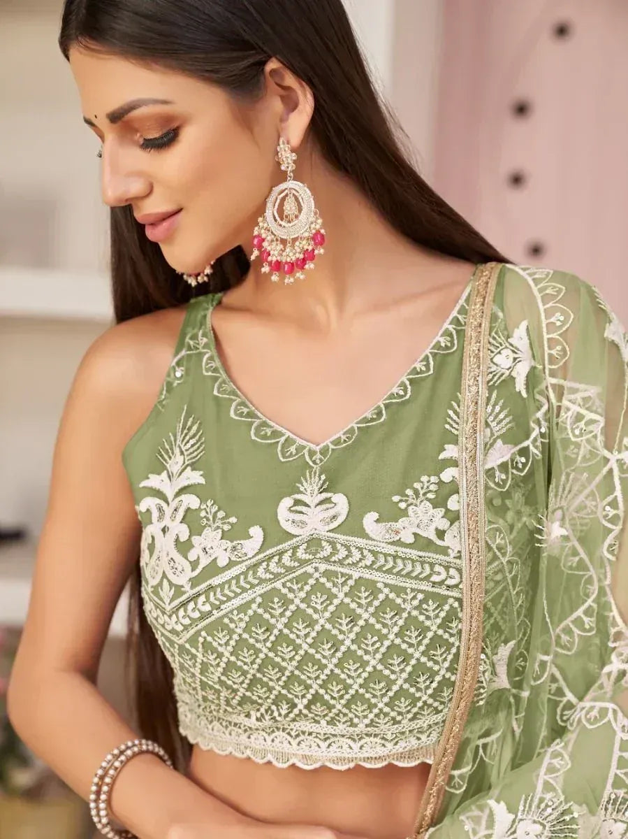 Green embroidered crop top with white lace detailing, paired with matching dupatta, ideal for Indian ethnic wear.