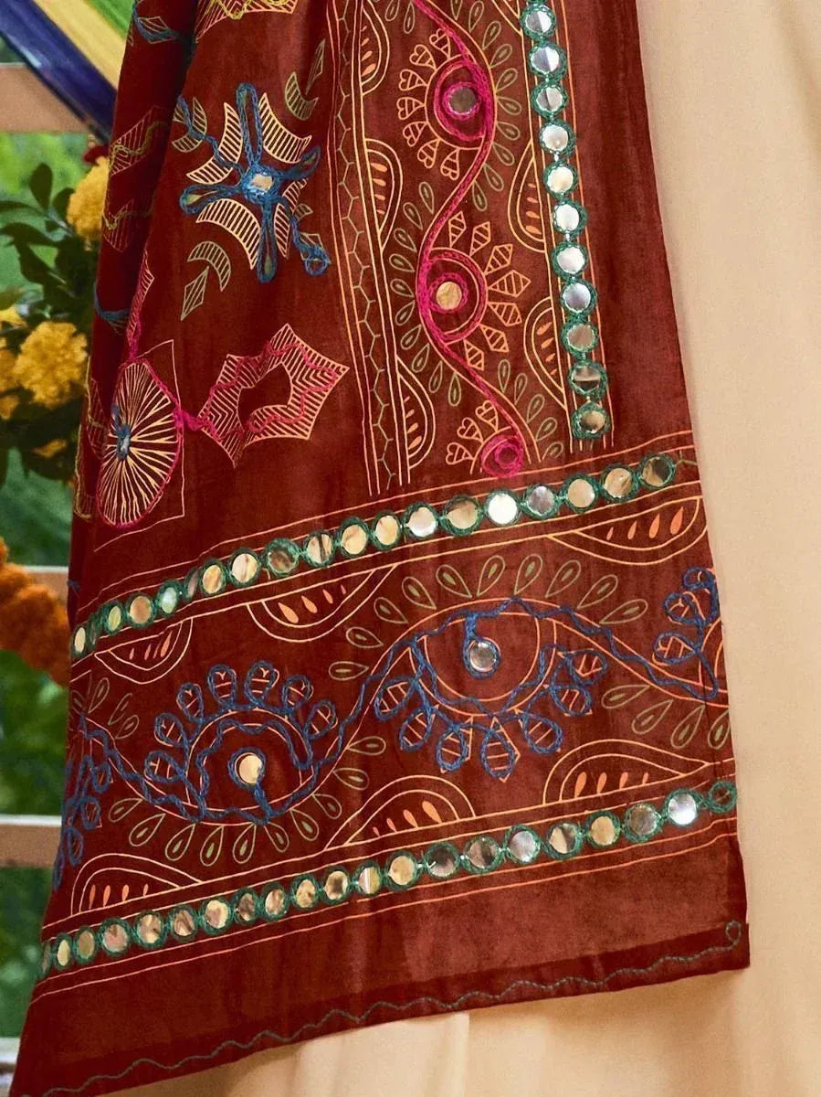 Rich maroon ethnic gown with mirror work and colorful embroidery, perfect for Indian festive wear.