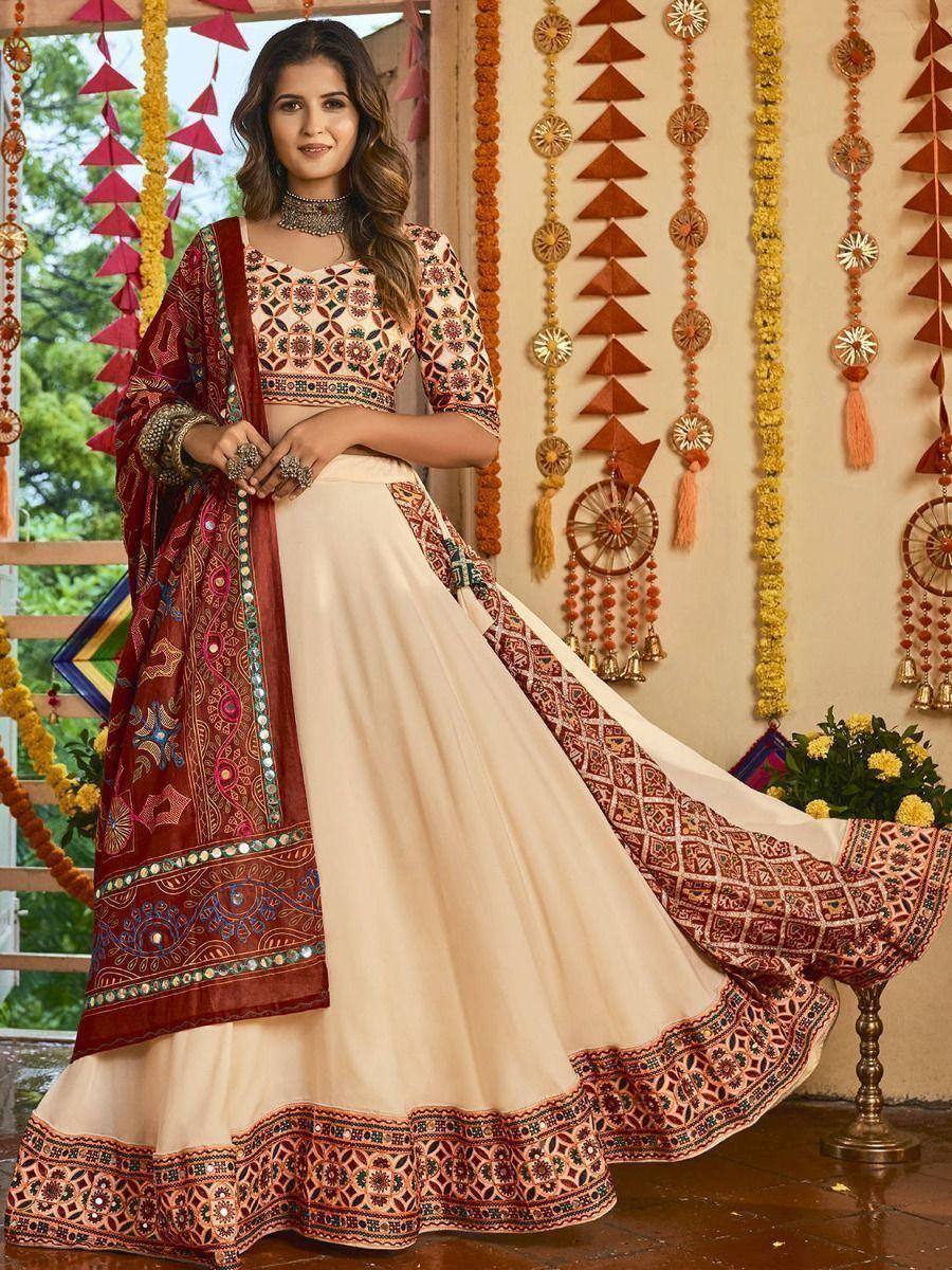 Elegant cream and maroon embroidered lehenga choli with mirror work, perfect for Indian ethnic occasions
