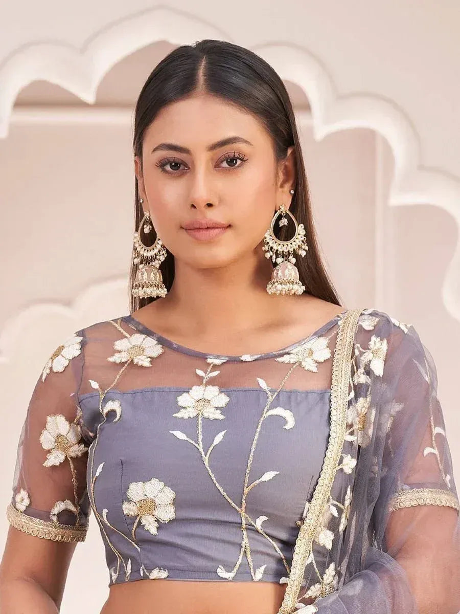 Grey floral embroidered blouse with sheer sleeves and gold trim, paired with statement jhumka earrings