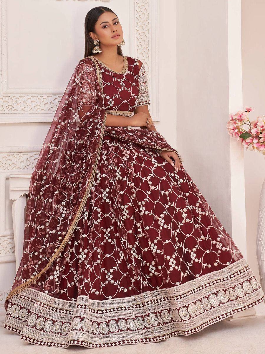 Maroon embroidered lehenga choli with floral net dupatta, perfect for weddings and festive occasions