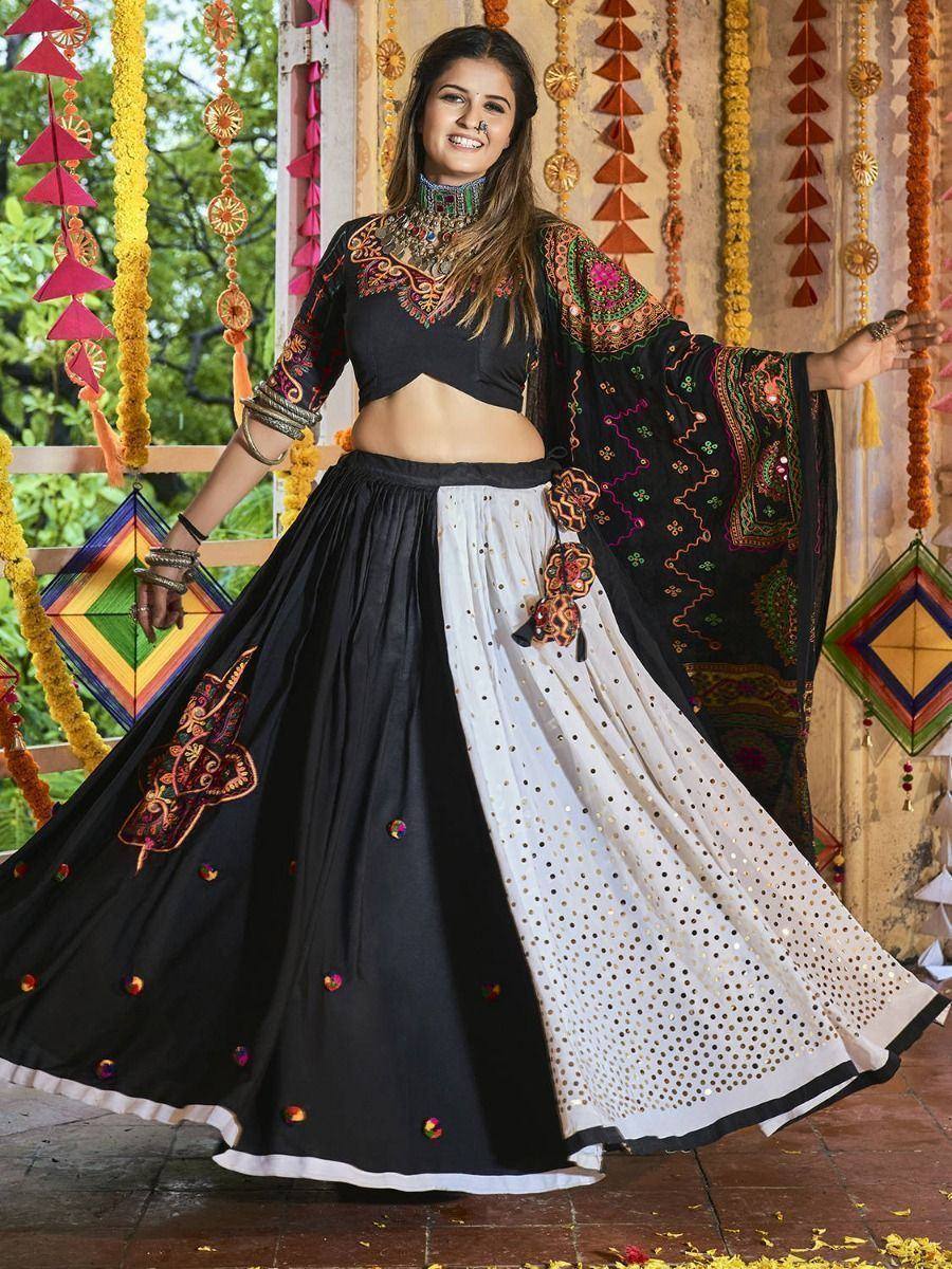 Black and white embroidered lehenga choli with mirror work, perfect for Indian ethnic occasions
