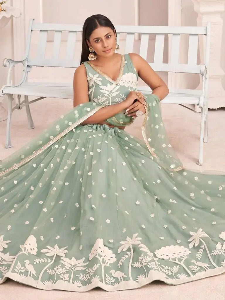Ravishing Pista Green Butterfly Net White Cotton Thread Perfect Party Look Lehenga