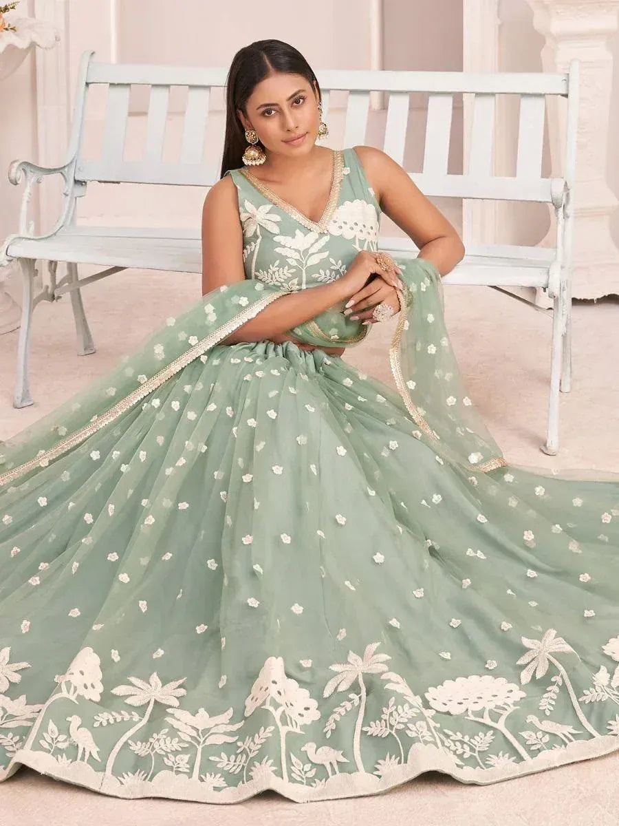 Mint green designer lehenga choli with white floral embroidery, perfect for Indian ethnic wear occasions