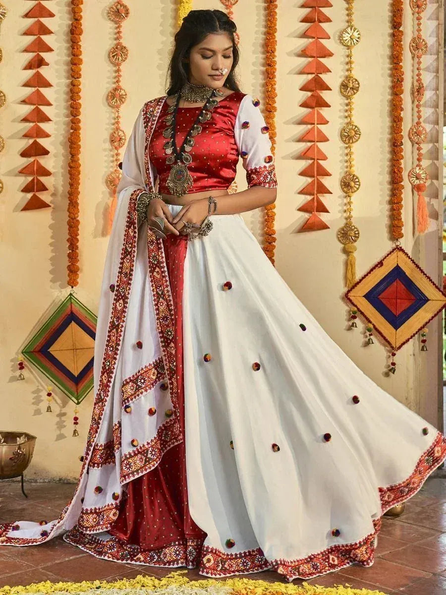 Red and white designer lehenga choli with embroidery, perfect for Indian ethnic occasions and festivals.