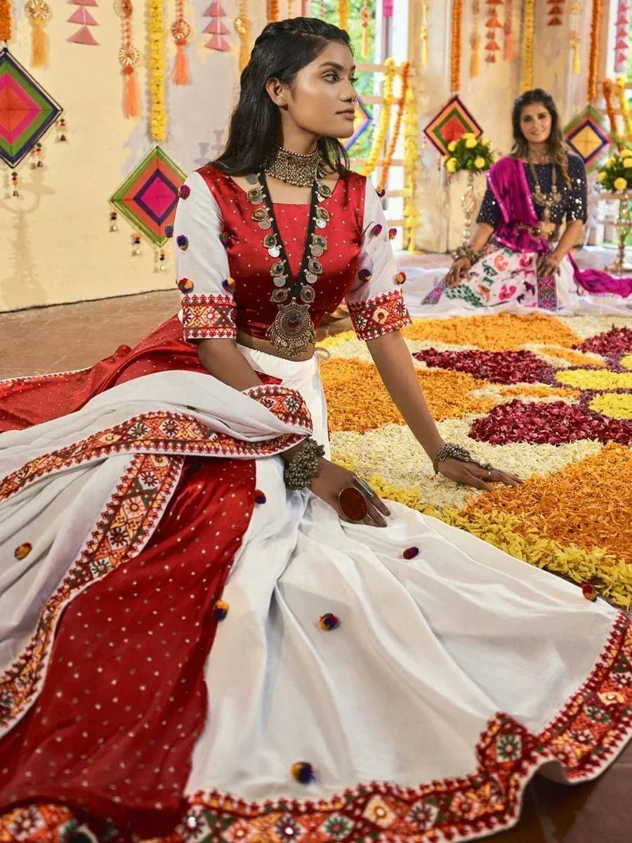 Red and white embroidered lehenga choli with mirror work, perfect for Indian ethnic occasions and weddings