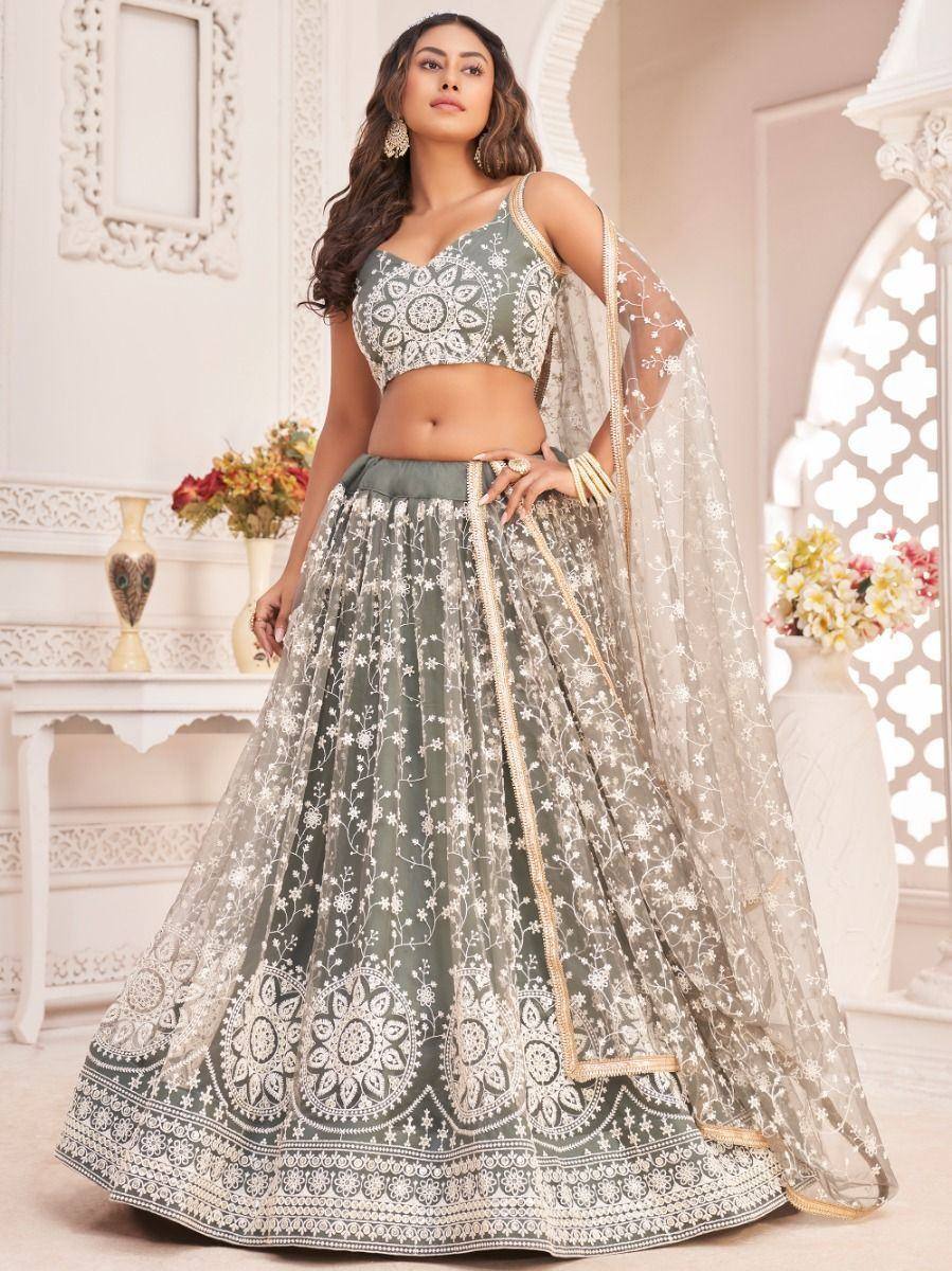 Elegant grey lehenga choli with white floral embroidery and sheer dupatta, perfect for Indian ethnic occasions.