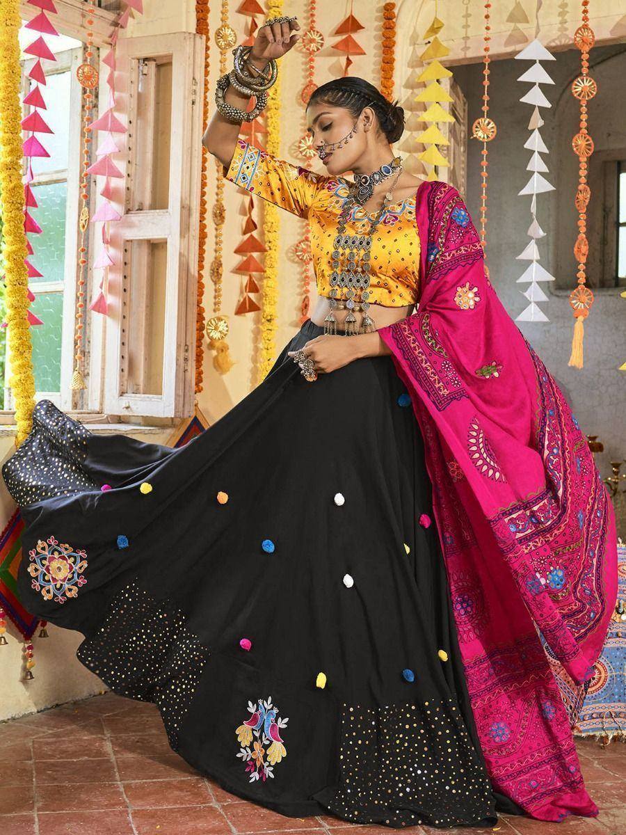 Black lehenga with yellow blouse and pink dupatta, festive Indian ethnic wear