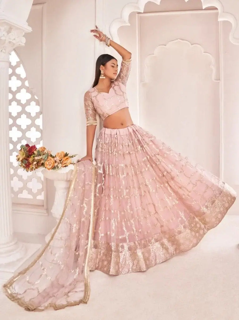 Prominent Pastel Pink Sequins Embroidery Net Lehenga Choli