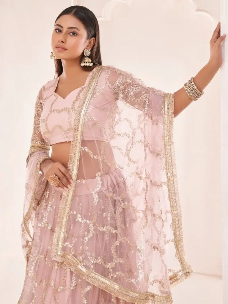 Prominent Pastel Pink Sequins Embroidery Net Lehenga Choli