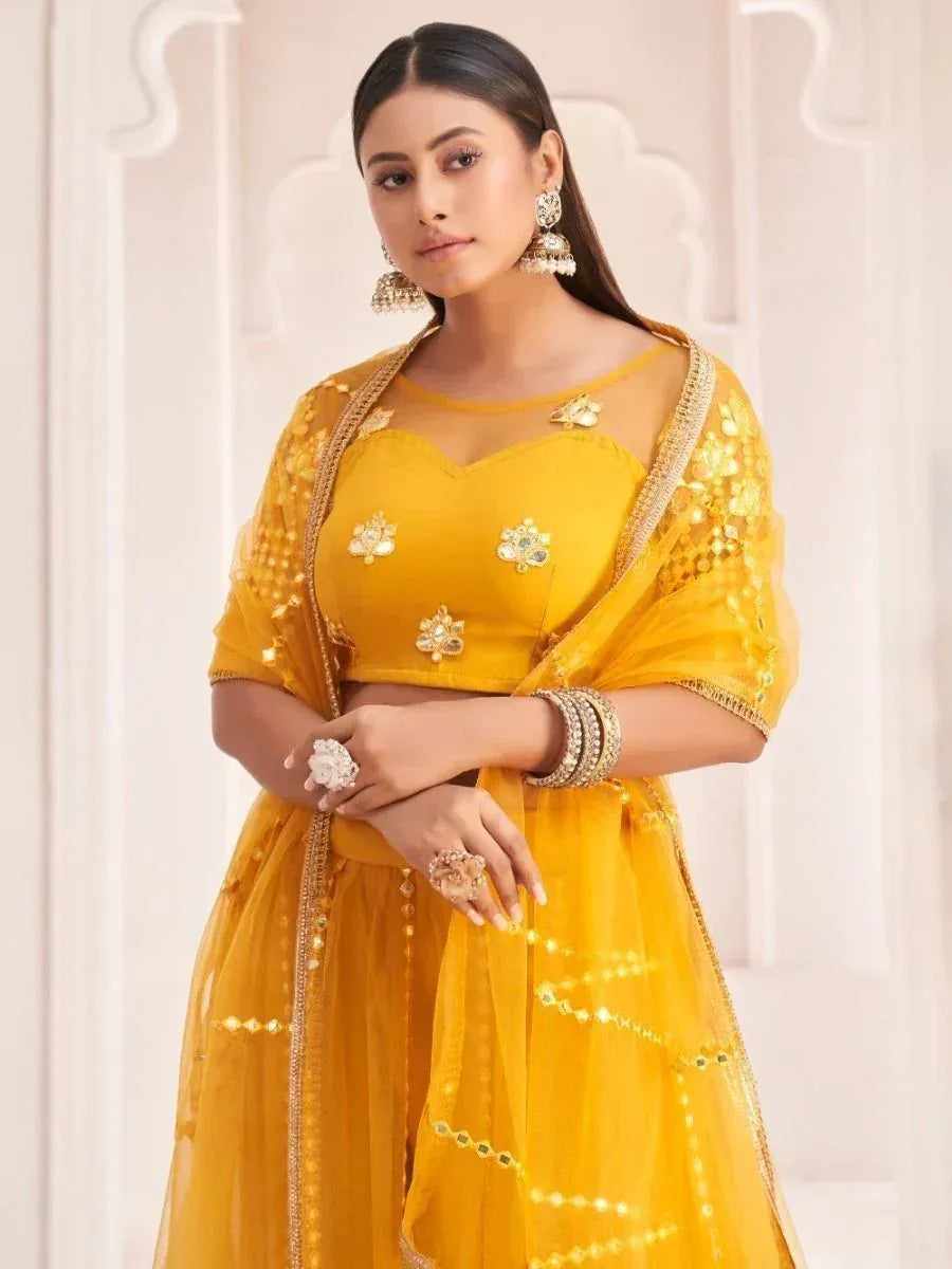 Yellow designer lehenga choli with floral embroidery and sequins, perfect for Indian ethnic wear occasions