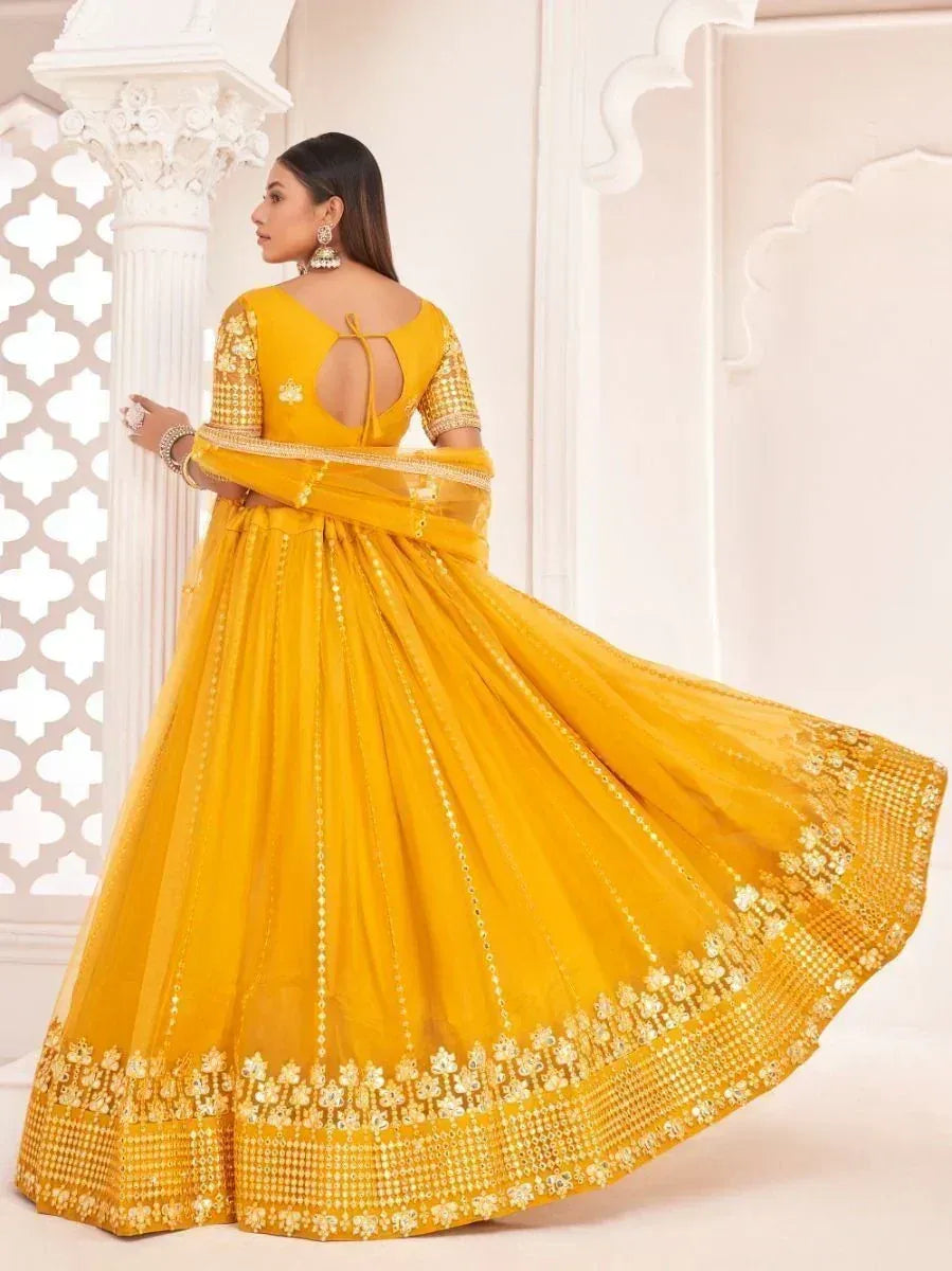Yellow designer lehenga choli with gold embroidery, perfect for Indian ethnic wear occasions