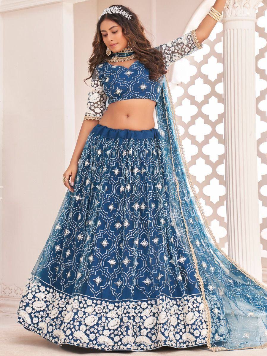 Blue and white embroidered lehenga choli with floral border, perfect for Indian ethnic wear occasions