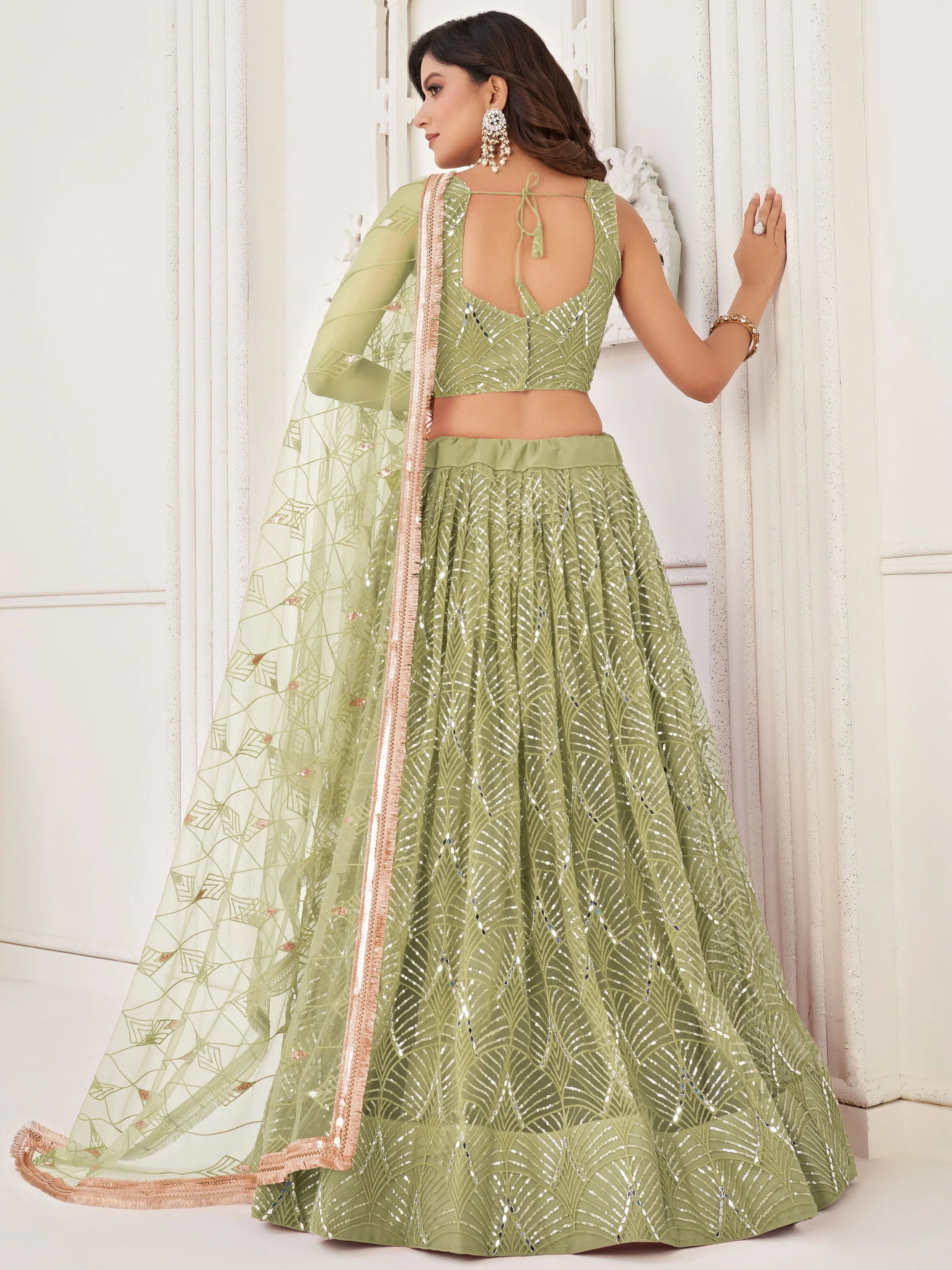 Wonderful Light Green Sequin Net Engagement Wear Lehenga Choli