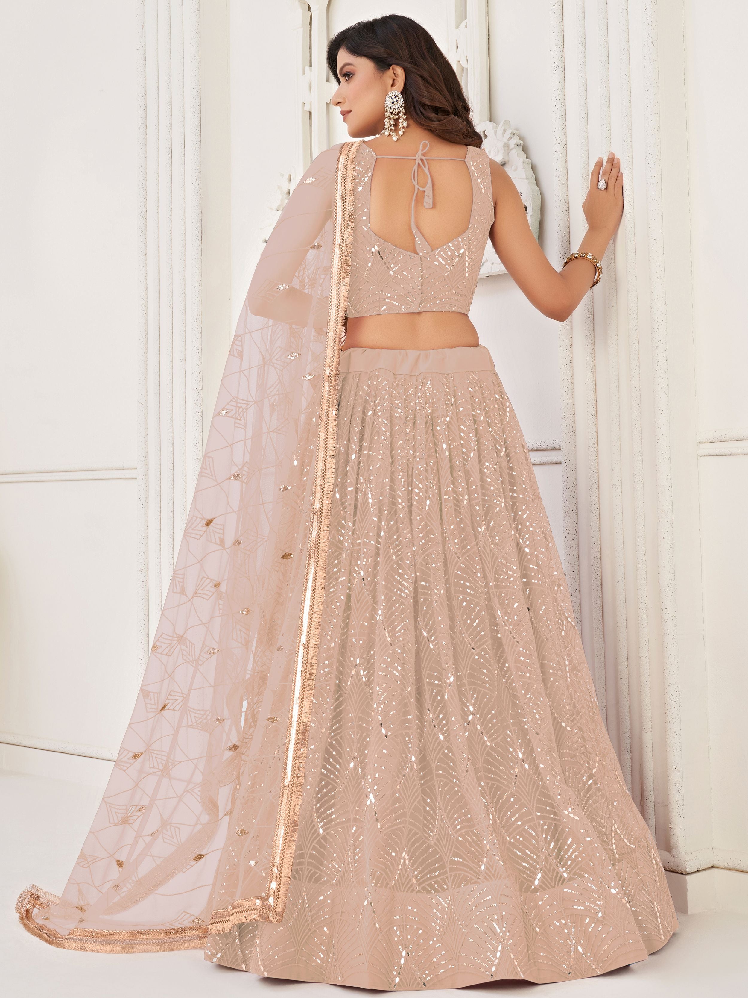 Captivating Beige Embroidered Net Engagement Wear Lehenga Choli 