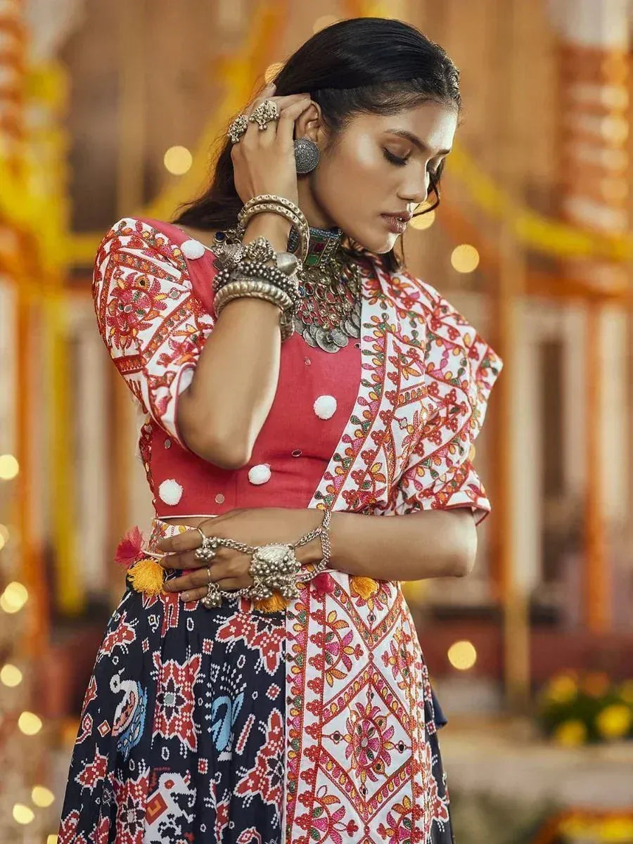 Woman in vibrant Indian ethnic lehenga choli with intricate embroidery and traditional jewelry