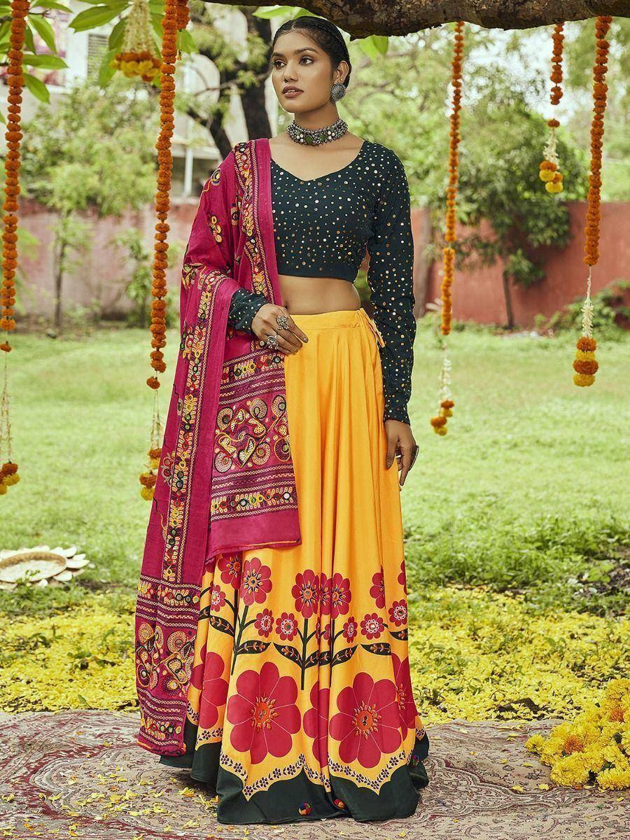 Yellow floral print lehenga with black dotted blouse and pink dupatta, perfect for Indian ethnic occasions