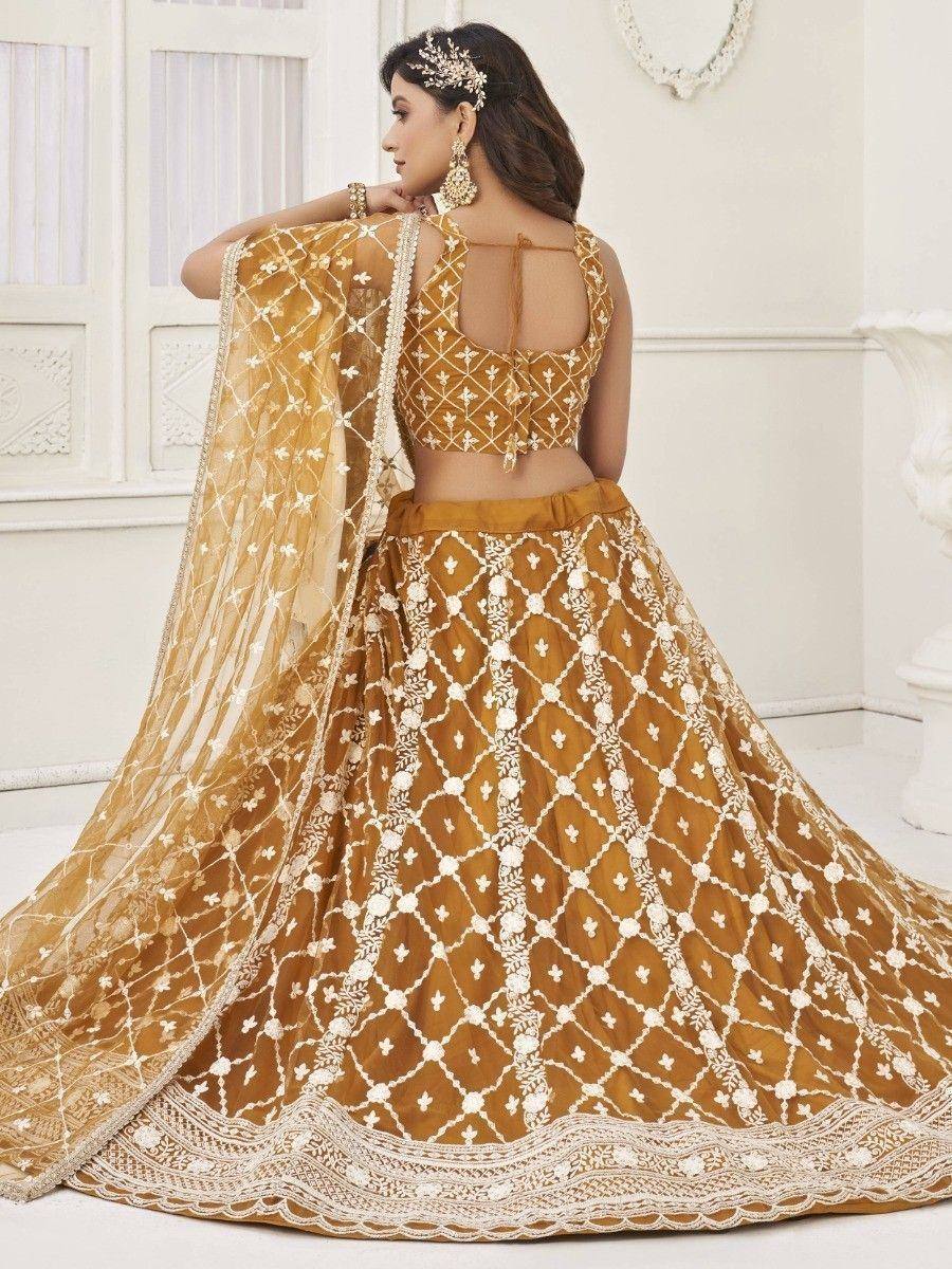 Mustard yellow designer lehenga choli with white embroidery and sheer dupatta, ethnic Indian wear