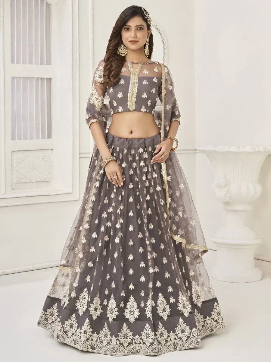 Grey embroidered lehenga choli with gold detailing, perfect for weddings and festive occasions