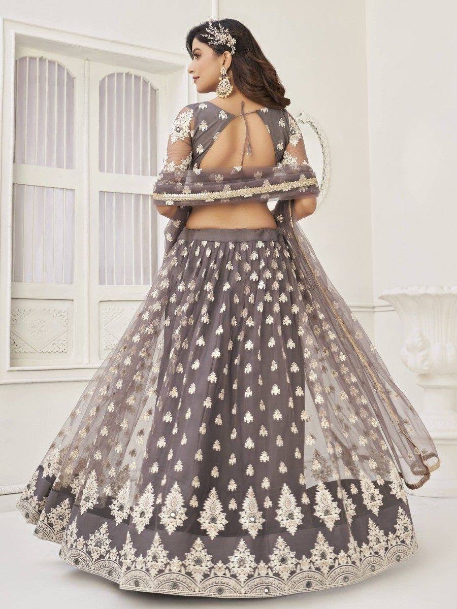 Grey designer lehenga choli with gold embroidery, sheer dupatta, and backless blouse for Indian ethnic wear