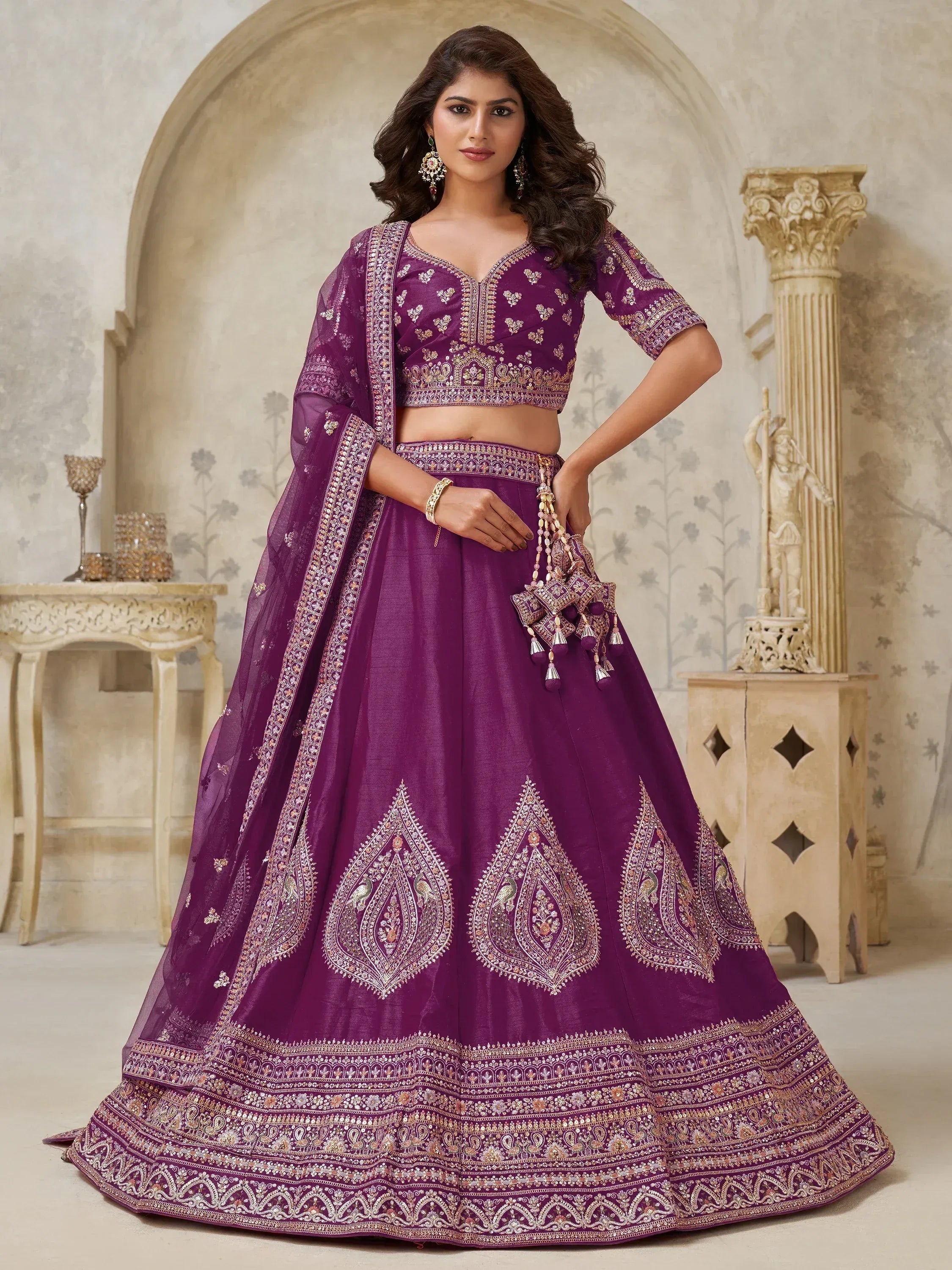 Elegant purple lehenga choli with intricate embroidery and golden detailing for Indian ethnic wear