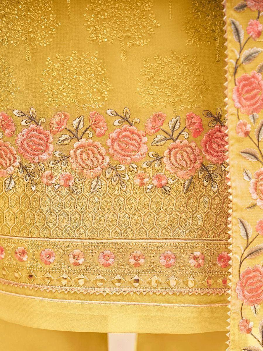 Yellow ethnic dress with pink floral embroidery and gold detailing, perfect for Indian occasions
