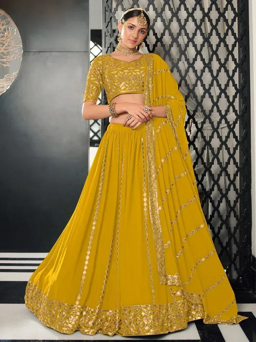 Yellow designer lehenga choli with gold embroidery, perfect for Indian ethnic wear occasions