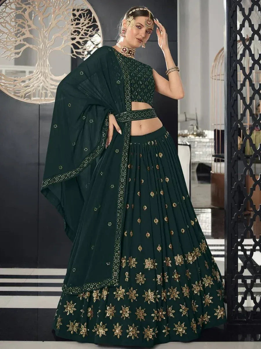 Emerald green designer lehenga choli with gold floral embroidery, perfect for Indian ethnic wear occasions.