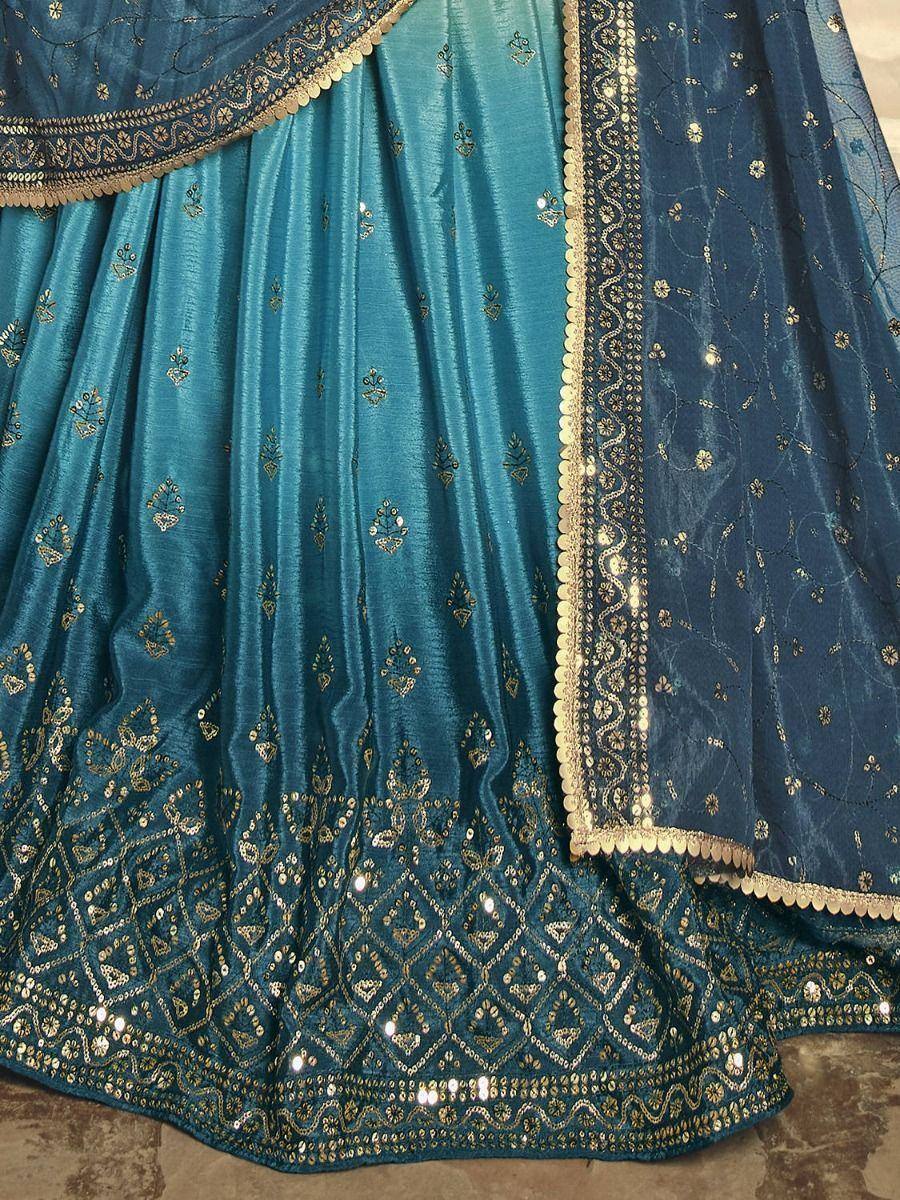Teal blue lehenga choli with gold embroidery and sequin detailing, ethnic Indian wear
