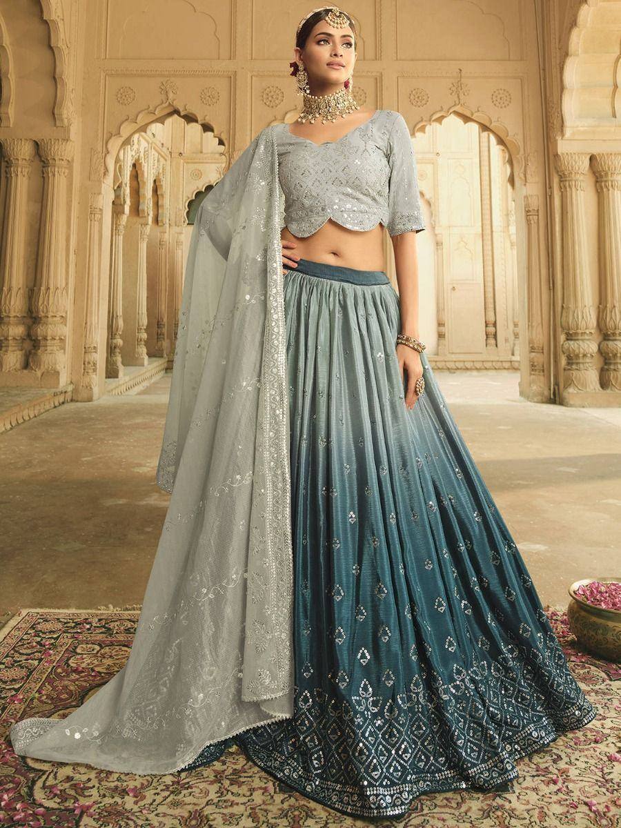 Elegant blue lehenga choli with silver embroidery, perfect for Indian weddings and festive occasions