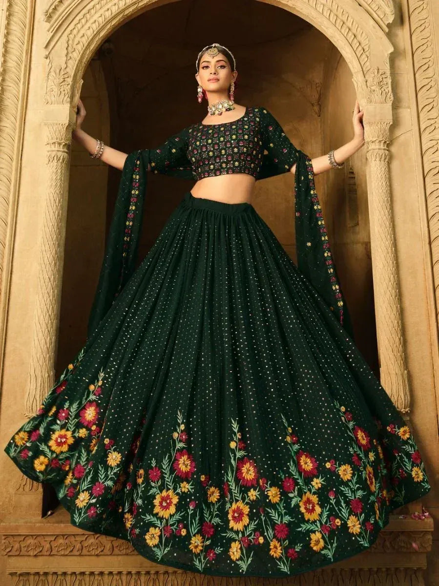 Emerald green floral lehenga choli with embroidered skirt and blouse, perfect for Indian ethnic occasions.