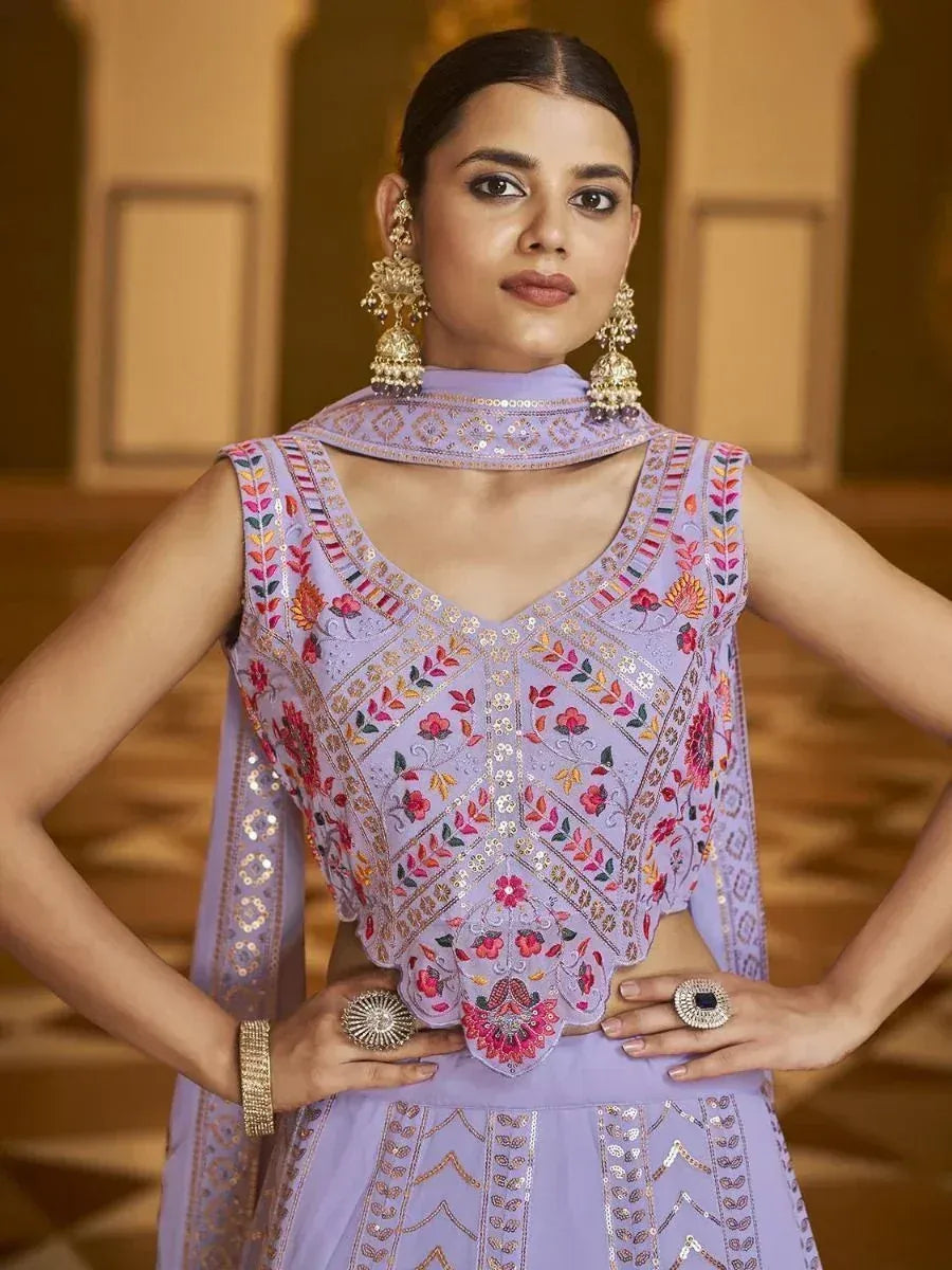 Lavender embroidered designer lehenga choli with floral motifs and sequin detailing, perfect for Indian ethnic wear.
