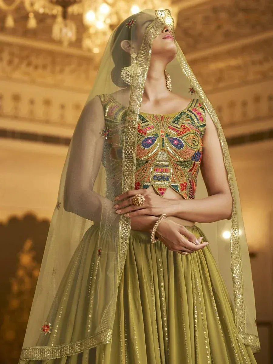 Olive green designer lehenga choli with butterfly embroidery and sheer dupatta, ethnic Indian wear