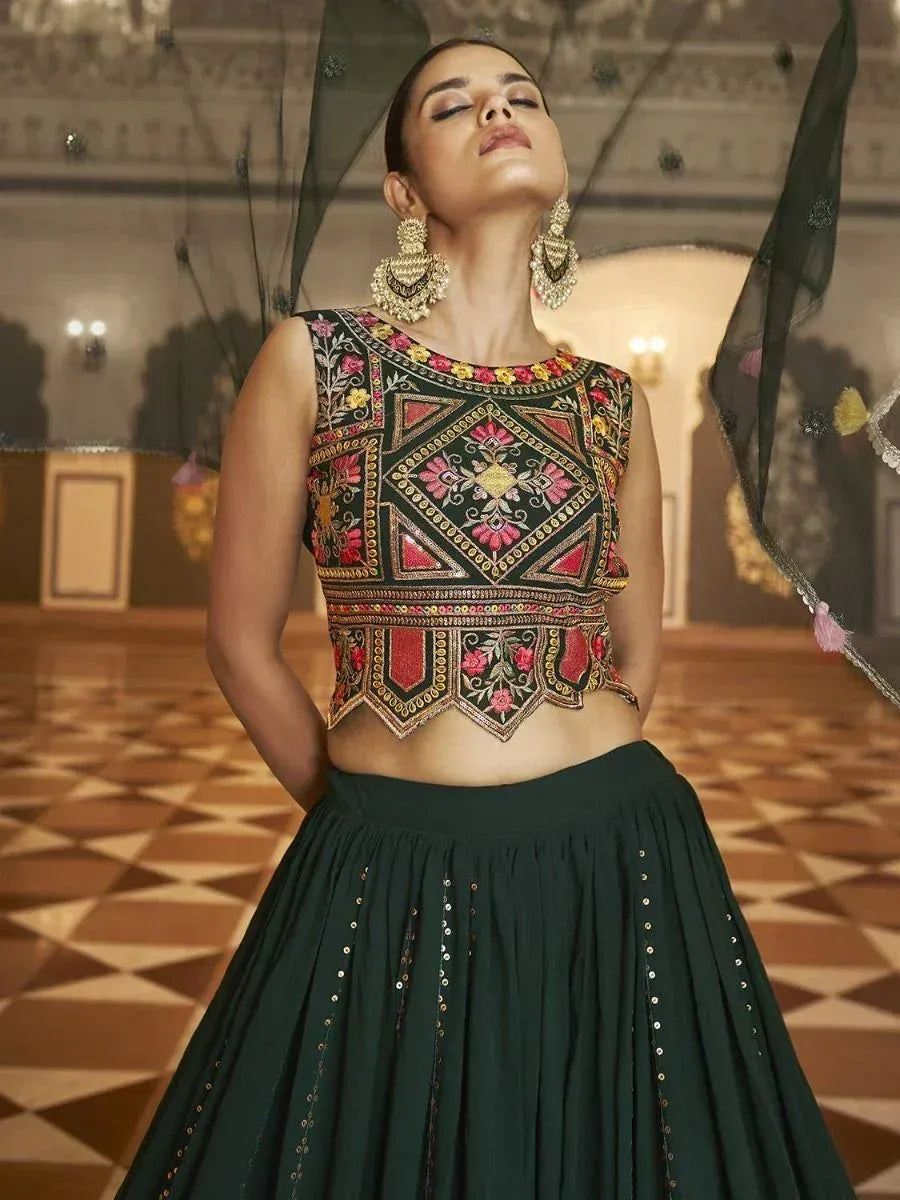Emerald green embroidered lehenga choli with floral motifs, perfect for Indian ethnic wear occasions.